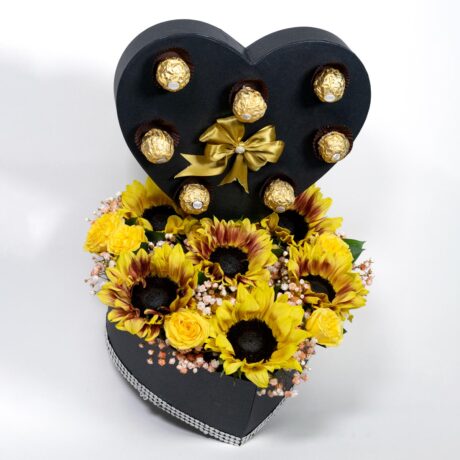 caja de flores corazón con girasoles y chocolates