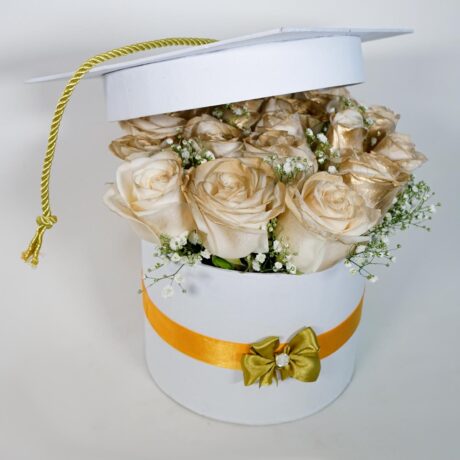 caja de flores tambor con rosas doradas